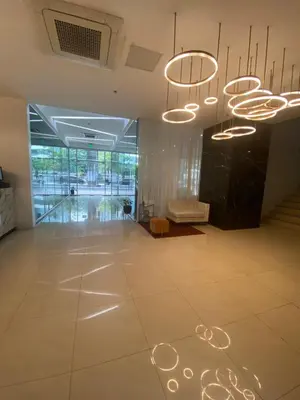 a lobby with a large room with lights on the floor at EDSA Heights Ama Tower Unit 3305 Loft Penthouse Unit in Manila