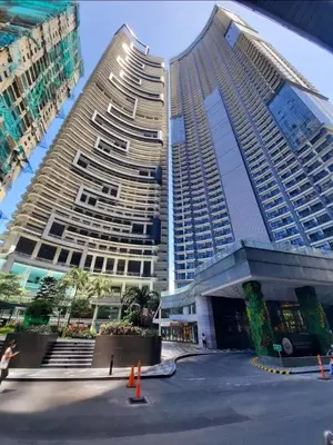two large tall buildings in a city at Condominium unit Knightsbridge Residences, Makati in Manila