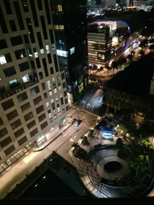 an aerial view of a city street at night at Condominium unit Knightsbridge Residences, Makati in Manila