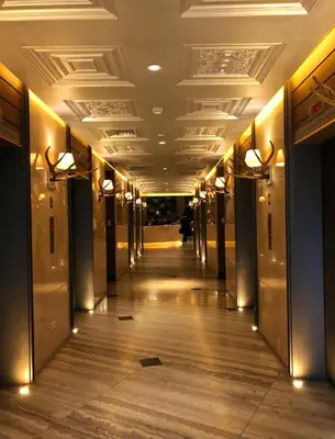 a hallway in a building with lights on the ceiling at Condominium unit Knightsbridge Residences, Makati in Manila