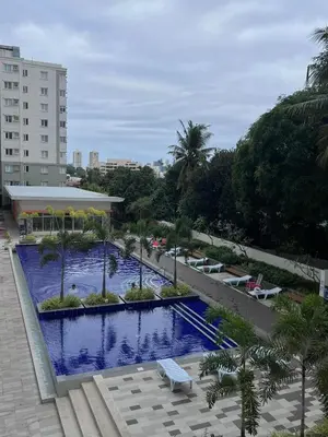 a view of a swimming pool from a building at Staycation at JG in Manila