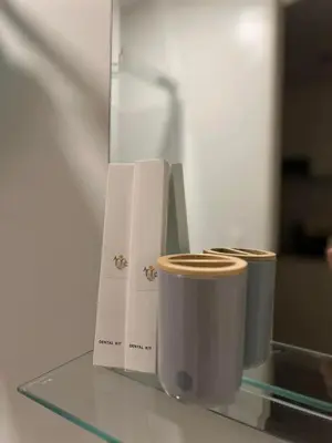 two toilets sitting on top of a glass table at Staycation at JG in Manila