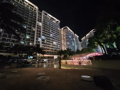 a view of a hotel at night with buildings at City Escape in Manila