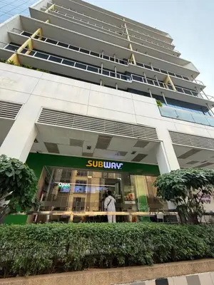 a man standing in front of a building at One Palmtree Villas in Manila