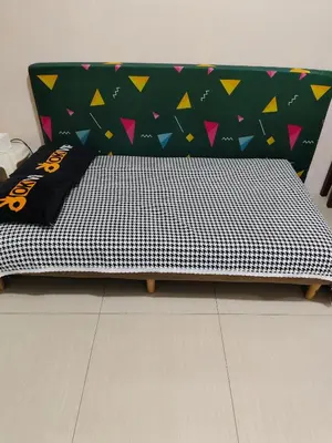 a bed with a black and white comforter on it at Shell residences Moa Staycation by jeric in Manila