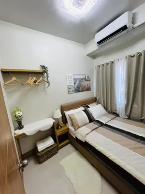 a bedroom with a bed and a window at MOA GRAND STAY Suite #01, Newly Turn-over Only! in Manila