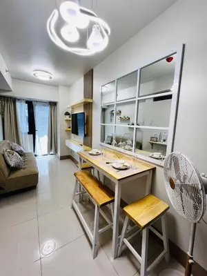 a kitchen with a table and chairs in a room at MOA GRAND STAY Suite 04 Newly Turn-over Only! in Manila