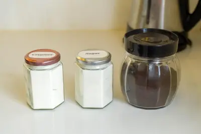 three jars sitting on a counter next to a blender at Serene City Abode in Santa Rosa
