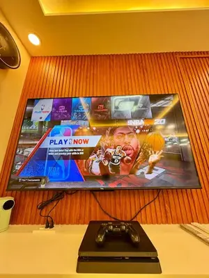 a sign on a wall with a game controller at Family Game Night 2BR PS4 Netflix Disney in Manila