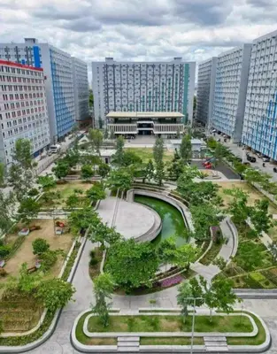 a park in a city with tall buildings at Family Game Night 2BR PS4 Netflix Disney in Manila