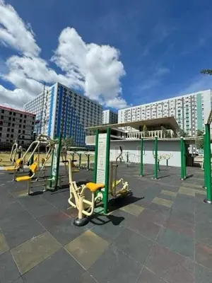 a parking lot with a bunch of playground equipment at Family Game Night 2BR PS4 Netflix Disney in Manila