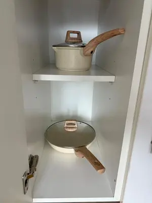 a shelf with a pot and a bowl on it at Test in Manila