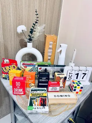 a table with books on it with a bunch at The Metro Breeze - Staycation in Manila