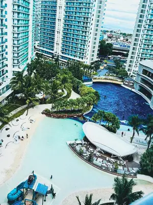 an aerial view of a resort with a large pool at Celestial Shores Staycation at Azure Resort in Manila
