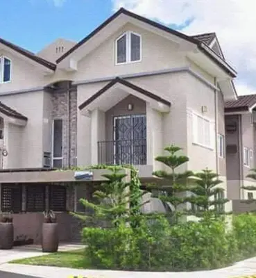 a large white house with trees in front of it at Our home is your castle in Caong