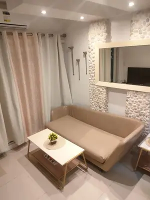 a living room with a couch and a table at Sea Residence - 2 Bedrooms - 5 mins walk to MOA 1A in Manila