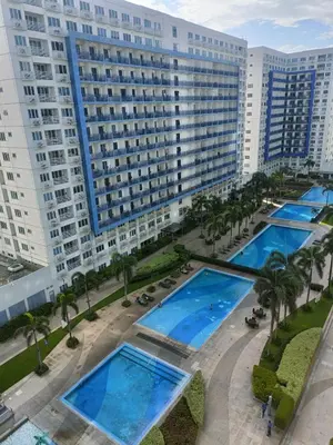an aerial view of a large building with several pools at Allie's Cozy Place in Manila