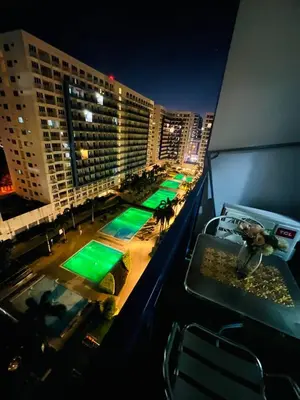 a view of a balcony of a hotel at night at Allie's Cozy Place in Manila