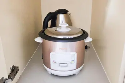 a tea kettle is sitting on a wall at 2 Bedroom Condo in Front of SM Mall of Asia in Manila