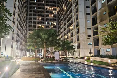 a swimming pool in the middle of a building at Condo in SM Mall of Asia MOA near NAIA Airport in Manila