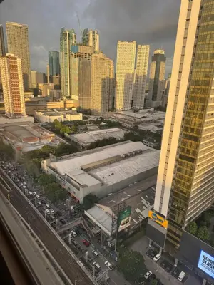 an aerial view of a city with tall buildings at PaulBert's Cabins I in Manila