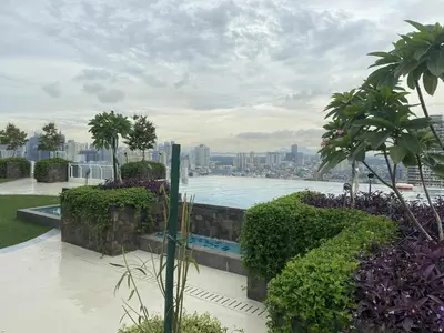 a view of a swimming pool on top of a building at Apartment 28 in Manila