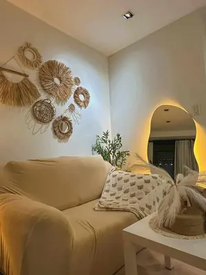a living room with a couch and a mirror at Cozy and Aesthetic Vibes - Makati Manila Staycation in Manila