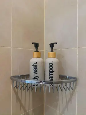 two rolls of toilet paper on a shelf in a bathroom at Cozy and Aesthetic Vibes - Makati Manila Staycation in Manila