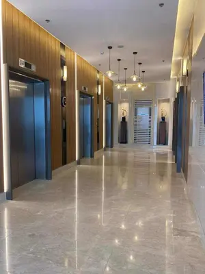 a hallway of a building with doors and a hallwayngth at JML's Condo at Shore 3 Tower 2 in Manila