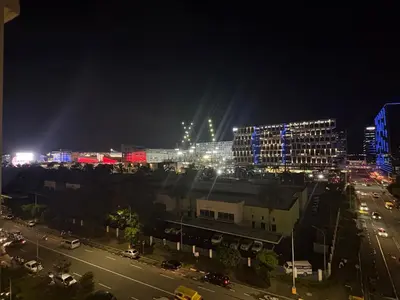 a city at night with buildings and street lights at Mall of Asia View Condo Living - Shore in Manila