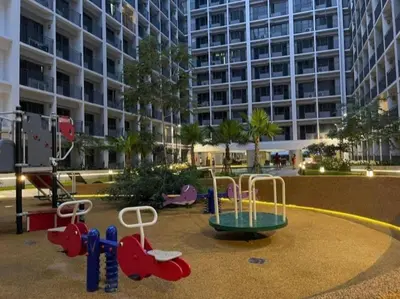 a playground in front of a large building at Marika's Place near Airport, DFA, Mall of Asia and OWWA in Manila