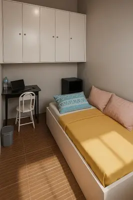 a small bedroom with a bed and a desk at Islana Stay Rm B for 1pax only in General Trias