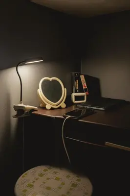 a desk with a heart lamp and a laptop at Islana Stay Rm B for 1pax only in General Trias