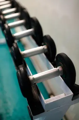 a row of dumbbells sitting on top of a table at LivStudios Manila Bay in Manila