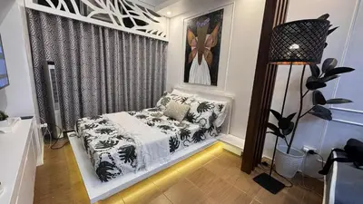 a small room with a bed and a window at 1BR Pioneer Woodland Condominium connected to BONI Metro Rail Station,Boni Mandaluyong Metro Manila in Manila
