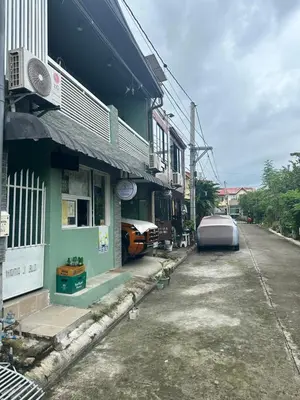 a building with a car parked next to a street at SJ Vistacation