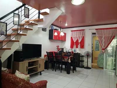 a living room with a table and a dining room at 1 Bedroom Townhouse with Airconditon ,Water heater and free wifi,fully furnished in San Roque