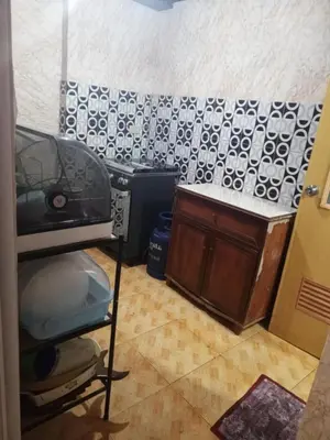 a room with a kitchen with a stove and a counter at 1 Bedroom Townhouse with Airconditon ,Water heater and free wifi,fully furnished in San Roque