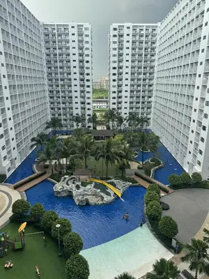 an aerial view of a water park in a city at Shore Residence Casa Margarita in Manila