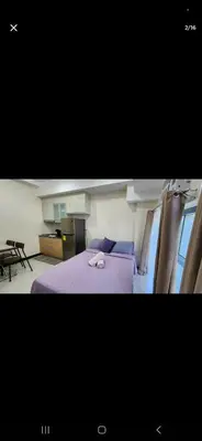 two pictures of a bedroom with a bed and a table at Condo unit in Taguig in Manila