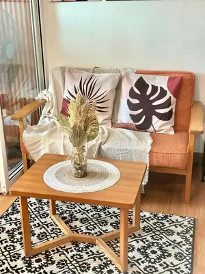 a living room with a couch and a coffee table at Cityscape Staycation by H&B in Manila