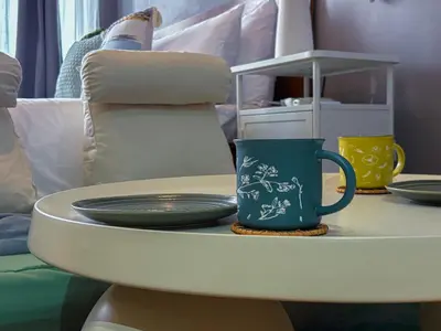 a table with plates and a coffee mug on it at Hidden Village at Gramercy Residences - APARTMENT with Infinity Pool Sauna Gym in Manila