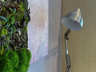 a lamp sitting next to a painting next to a plant at Hidden Village at Gramercy Residences - APARTMENT with Infinity Pool Sauna Gym in Manila