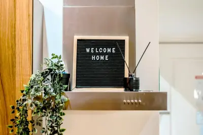 a welcome home sign sitting on top of a counter at Gramercy Makati Studio with Free Pool Gym and Sauna in Manila