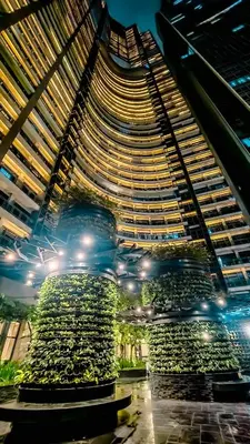 a large building with a large plant in front of it at Gramercy Makati Studio with Free Pool Gym and Sauna in Manila