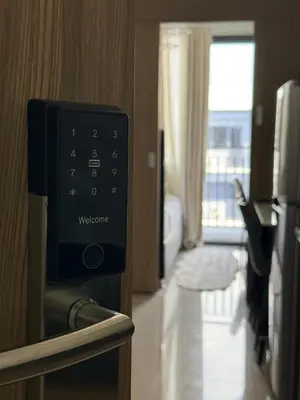 a hotel room with a welcome machine in a room at Affordable Stay at Shore Residence near MOA by VCA Staycation in Manila
