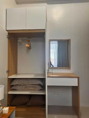 a closet with a desk and a mirror in a room at Cozy 1-Bedroom Staycation near NAIA & Mall of Asia in Manila