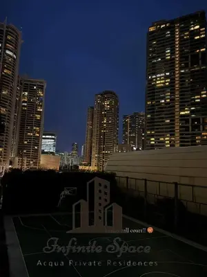 a city skyline at night with tall buildings at Staycation in Detifoss in Manila