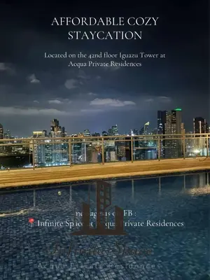a view of a city skyline with a bridge at Staycation in Detifoss in Manila