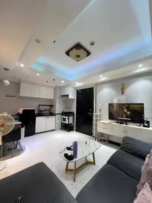 a large living room with a couch and a table at Apartment 1BR Condo Manila- Suntrust Adriatico Gardens Malate in Manila